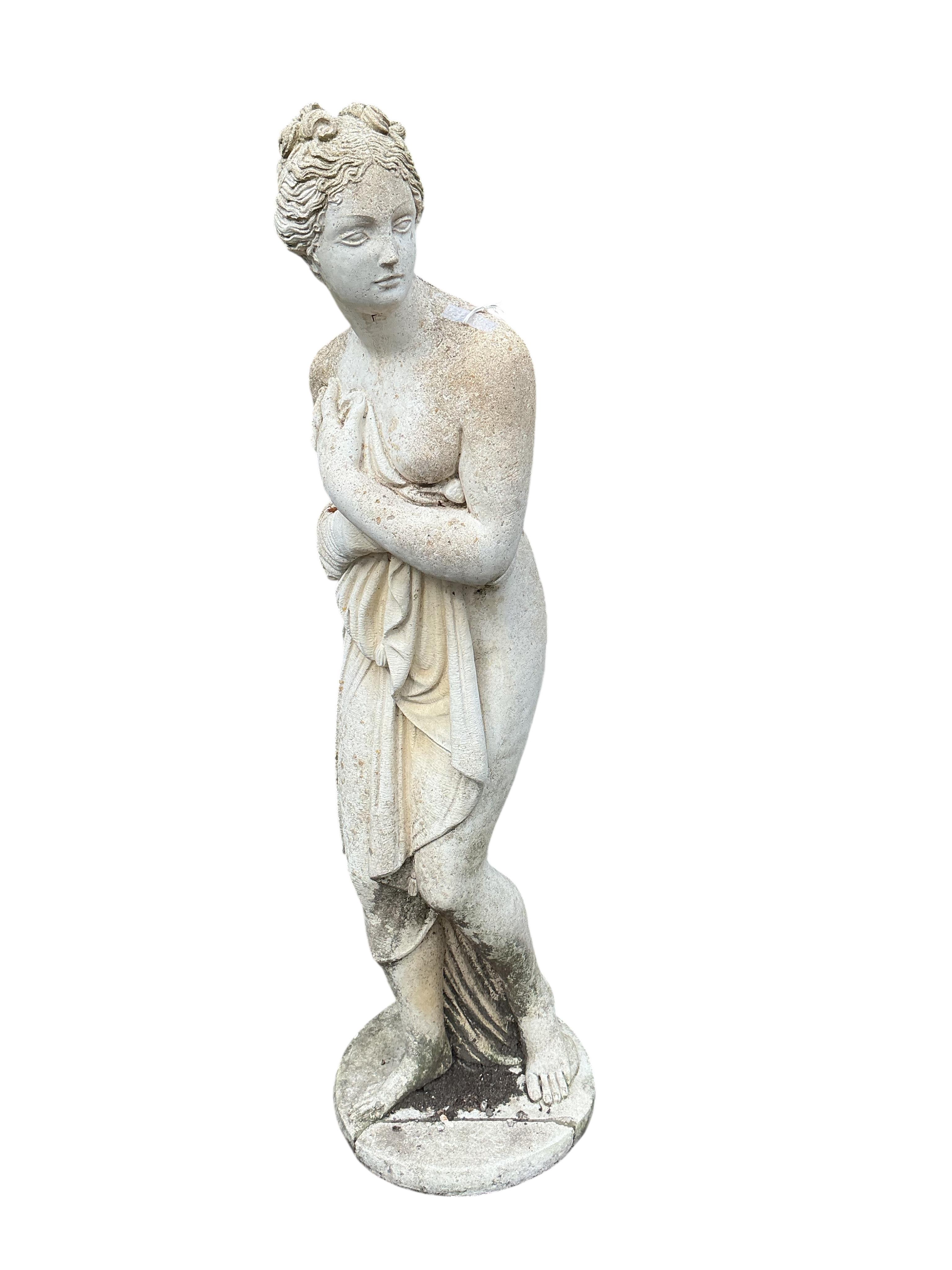 A reconstituted stone garden ornament of a female bather, base damaged, height 116cm